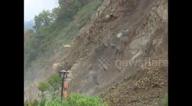 Massive landslide blocks mountain road in China