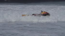 Wave gets the better of jet ski riders