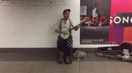 Awesome banjo-playing busker