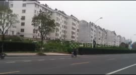 Graveyard with hundreds of tombs built adjacent to residential building in China