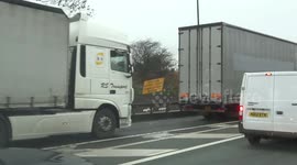 Driver on M60 Manchester using tablet device at the wheel