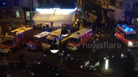 Police searching a mans vehicle close to Bataclan
