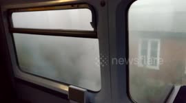 Smoke pours from Surrey commuter train