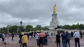 Mounted police pass flag flying half mast at Buckingham Palace after Queen’s death