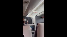 BA flight assistant wipes tears from her eyes as death of Queen Elizabeth announced