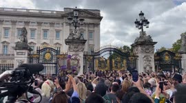 Buckingham palace swamped as giant crown wreath is carried to the gates for Queen’s death