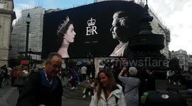 Screen at Piccadilly Circus displays images of the Queen on first day of official mourning