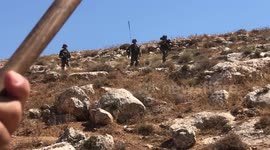 Palestinians take part in a demonstration against settlements in the village of Beit Dajan