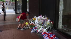 New York: People leave flowers in tribute to Queen Elizabeth II outside building that houses British Consulate General