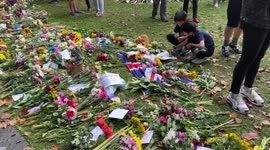 Queens floral tribute green park- children lay flowers and read messages left for the queen
