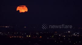 Stunning Harvest Moon seen 'peeking' through cloud cover in Kent, UK