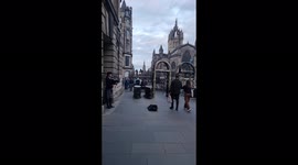 Bagpiper plays 'Scotland the Brave' in front of St Giles' Cathedral, where Queen's coffin will arrive on Monday