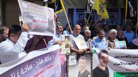 Palestinians take part in a protest in solidarity with cancer patient's prisoner Nasser Abu Hamid
