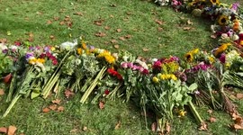 Thousands of people lay flowers in Green Park in tribute to the Queen.