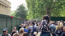 Huge queues form between Buckingham Palace and Green Park as thousands of people arrive to pay respects to the Queen