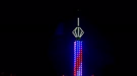 Strange reflections on evening sky from tower during filming amusement park ride