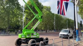 Workers install Union Jacks in The Mall ahead of the Queen’s funeral