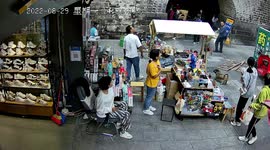Window narrowly misses pedestrians after falling off fourth floor of building in China
