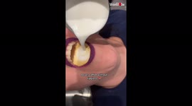 Odd way to make latte: barista pours coffee and milk into woman's mouth