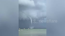 Huge waterspout tornado swirls across bay in the Philippines