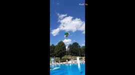 Daredevil makes waves with SPLASHING belly flop into pool