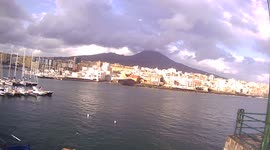 Vesuvius shrouded in clouds, on a rainy day, from the port of Torre del Greco, Naples