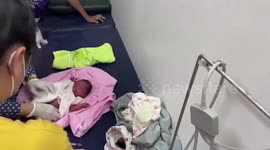 Abandoned baby boy dumped next to trash bin rescued by grandmother in Thailand