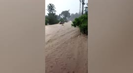Flash floods gush down roads after continuous heavy rain on Thai island