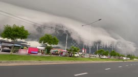 Ominous storm clouds that look like massive ‘tsunami waves’ hover road in Thailand