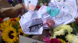 Floral tributes to Queen Elizabeth II around wall fountain in St James's Park in London
