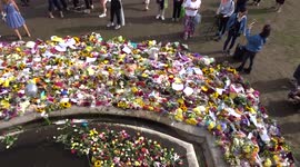 Floral tributes to Queen Elizabeth II around wall fountain at St James's Park - view from above