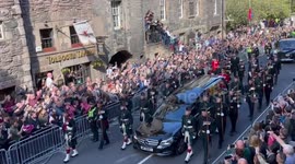 King Charles walks past picture of Princess Diana as he walks behind Queen's coffin in Edinburgh