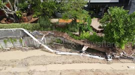 Coffee shop collapses as ground gives way following severe rain in Thailand