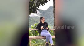 Scared tourist struggles to compose herself for selfie as goose approachs her