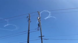 Plane leaves heart trails in the sky over California