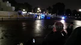 Queen Elizabeth II arrives at Buckingham Palace for final time as crowds cheer her coffin