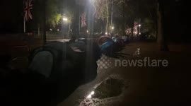 People camp outside Buckingham Palace to see queen's coffin being transported to Palace of Westminster