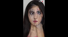 Artist paints her hand on face and face on hand as part of a MIND-BOGGLING look