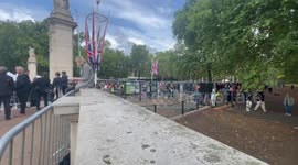 Thousands of people wait to witness the final departure of Queen Elizabeth II from Buckingham Palace