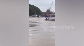 Terrified crew escape from tugboat sinking in river in Thailand
