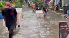Empty caskets float away on flood after monsoon storms in Thailand