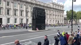 Royal fans claim their spots to watch the arrival of the coffin of Her Majesty Queen Elizabeth II at Westminster later today