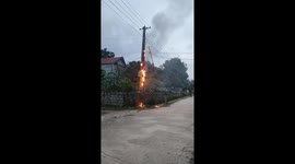 Locals team up to extinguish flaming utility pole in Vietnam