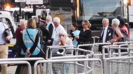 Tearful woman takes a moment to herself as she departs Queen Elizabeth II's lying in state