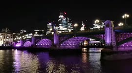 Southwark Bridge is lit up and Tower 43 shows LED flag to pay tribute to Queen Elizabeth II