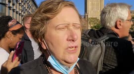 A woman recounts what she experienced when see tried to see the Queen move from Buckingham Palace to Westminster Hall. She experienced a lot of anger as the security doors to the streets of London closed at 12:30 pm
