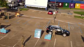 Jackson Mississippi water crisis, Army National Guard members handing out bottled water in North Jackson