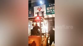 Forklift used to rescue family of 4 trapped in burning shop in China