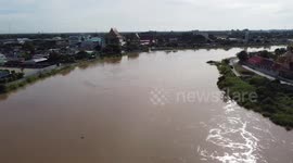 River overflows flooding people's homes in central Thailand