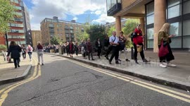 People Lining up to see the queen, goes past Tower Bridge and expands into the area of Bermondsey